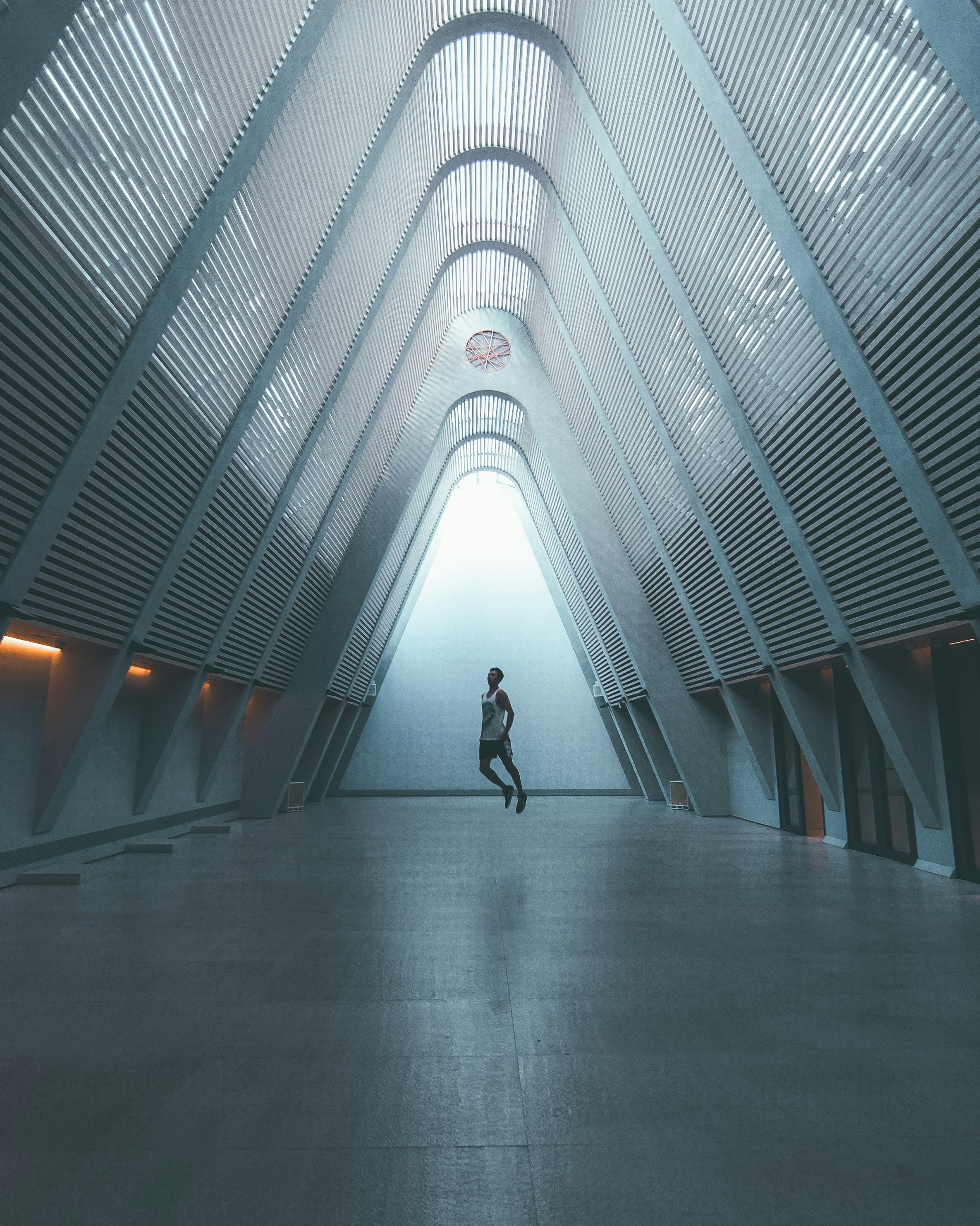 person standing inside gray metal structure